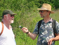 An oral history interview.  Tetra Tech cultural resource specialist Rob Jacoby (right) interviews Michael Cavanaugh on Davids Island in 2007.
